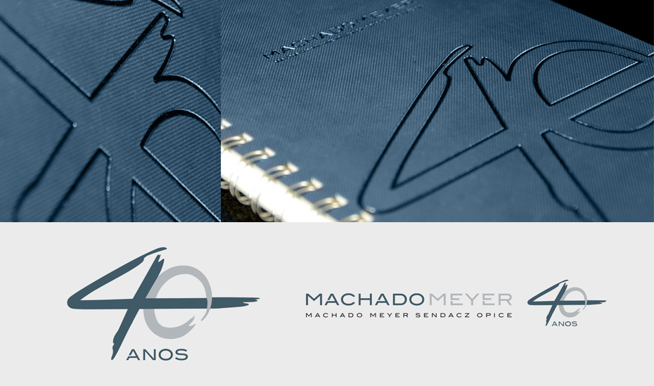 detalhe de caderno e sela 40 anos Machado Meyer Advogados